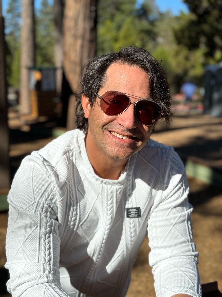 Juan Carlos Pineiro smiling outdoors